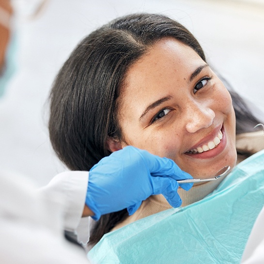 Female patient undergoing dental checkup