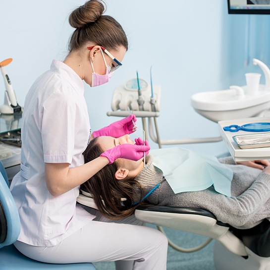 Female patient preparing for a dental cleaning