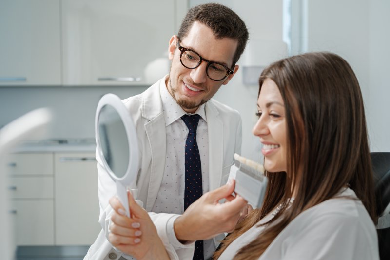 a woman smiling with new veneers